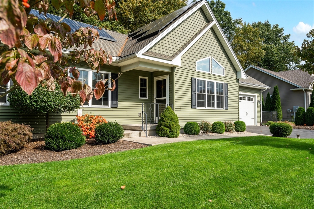 25 Paul Street Easthampton, MA 01027 - Photo 4 of 42 a view of a house with a yard and plants