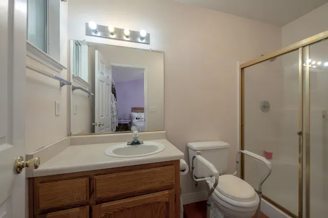 a bathroom with a sink toilet and shower
