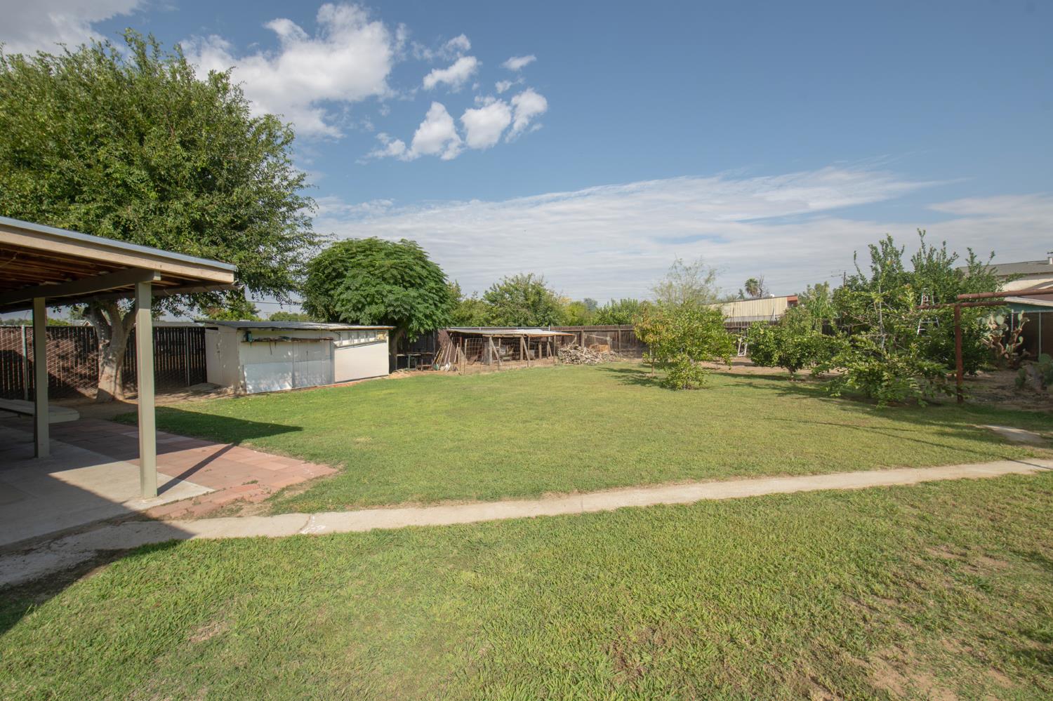 728 9th Street Sanger, CA 93657 - Photo 16 of 24 a view of a house with a yard