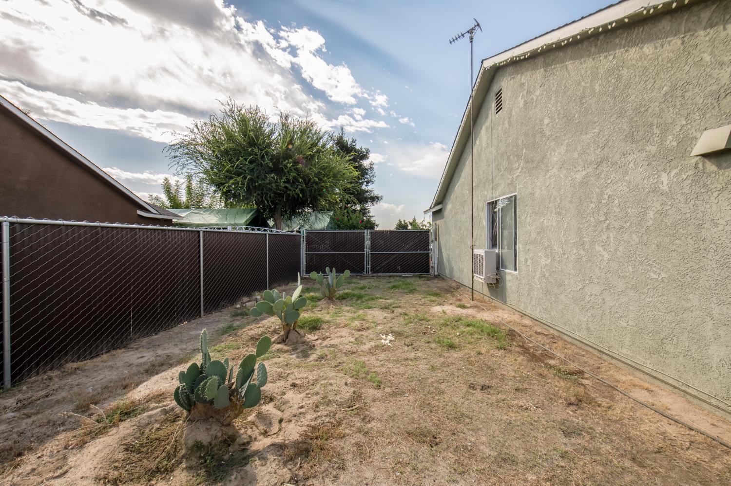 728 9th Street Sanger, CA 93657 - Photo 19 of 24 a view of backyard with green space