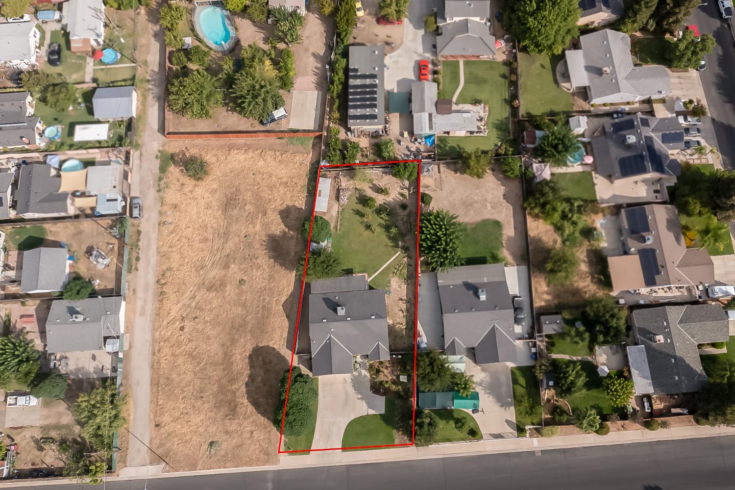 728 9th Street Sanger, CA 93657 - Photo 24 of 24 an aerial view of houses with outdoor space