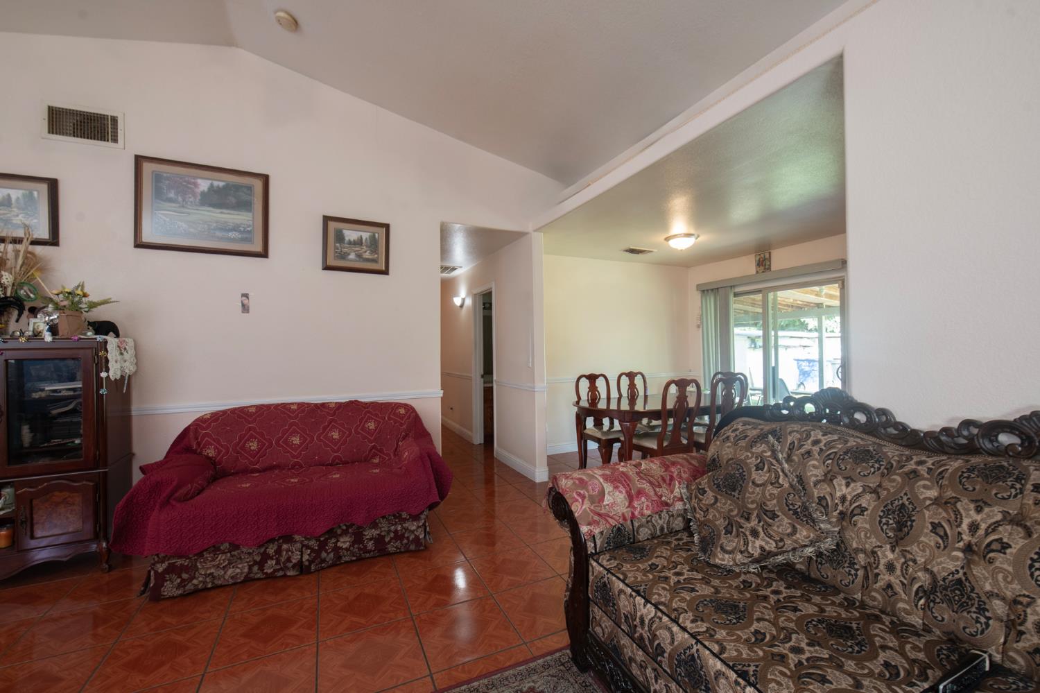 728 9th Street Sanger, CA 93657 - Photo 8 of 24 a bed room with a bed and a couch