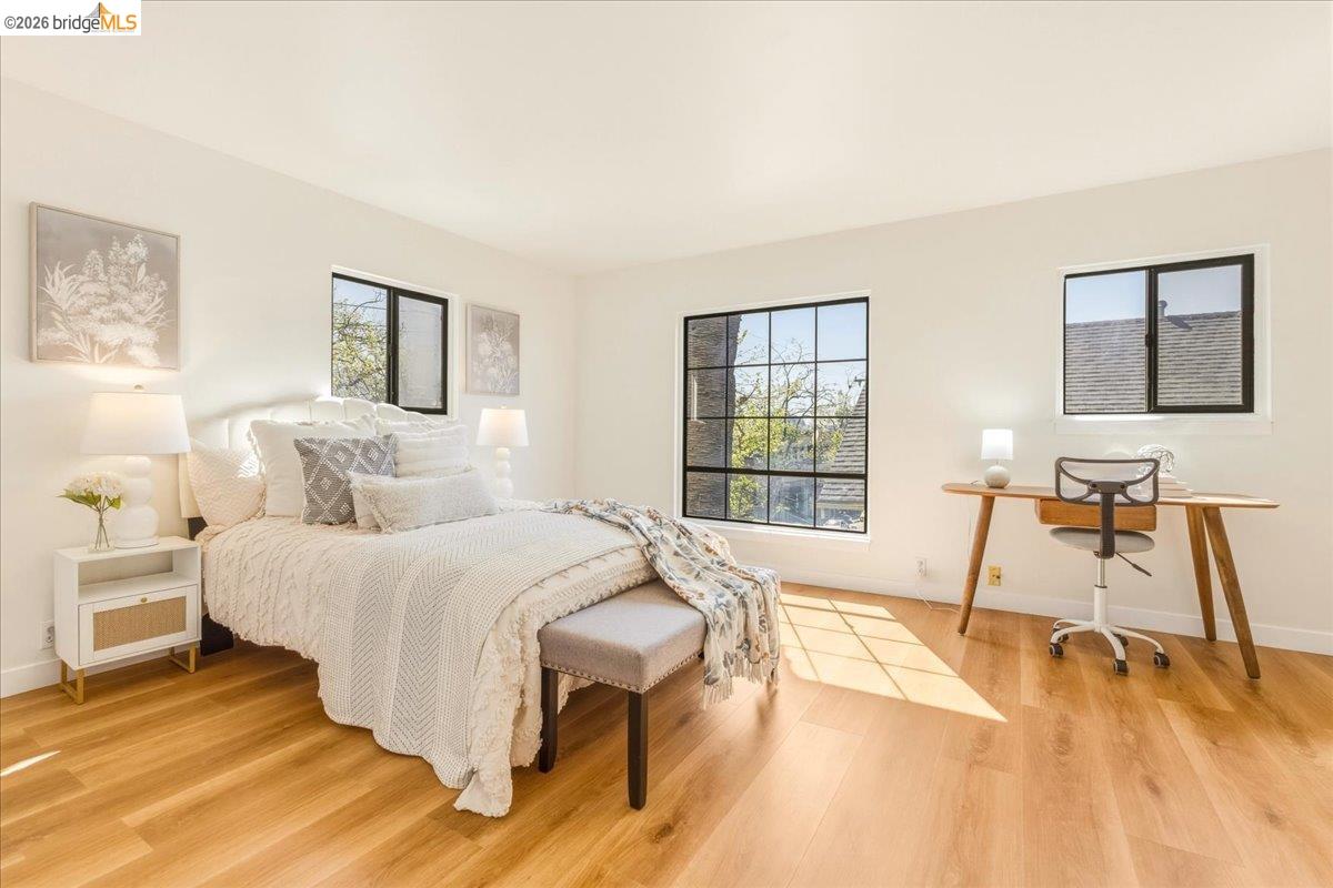 1408 Henry Street Berkeley, CA 94709 - Photo 14 of 28 Bedroom with baseboards and light wood-style flooring