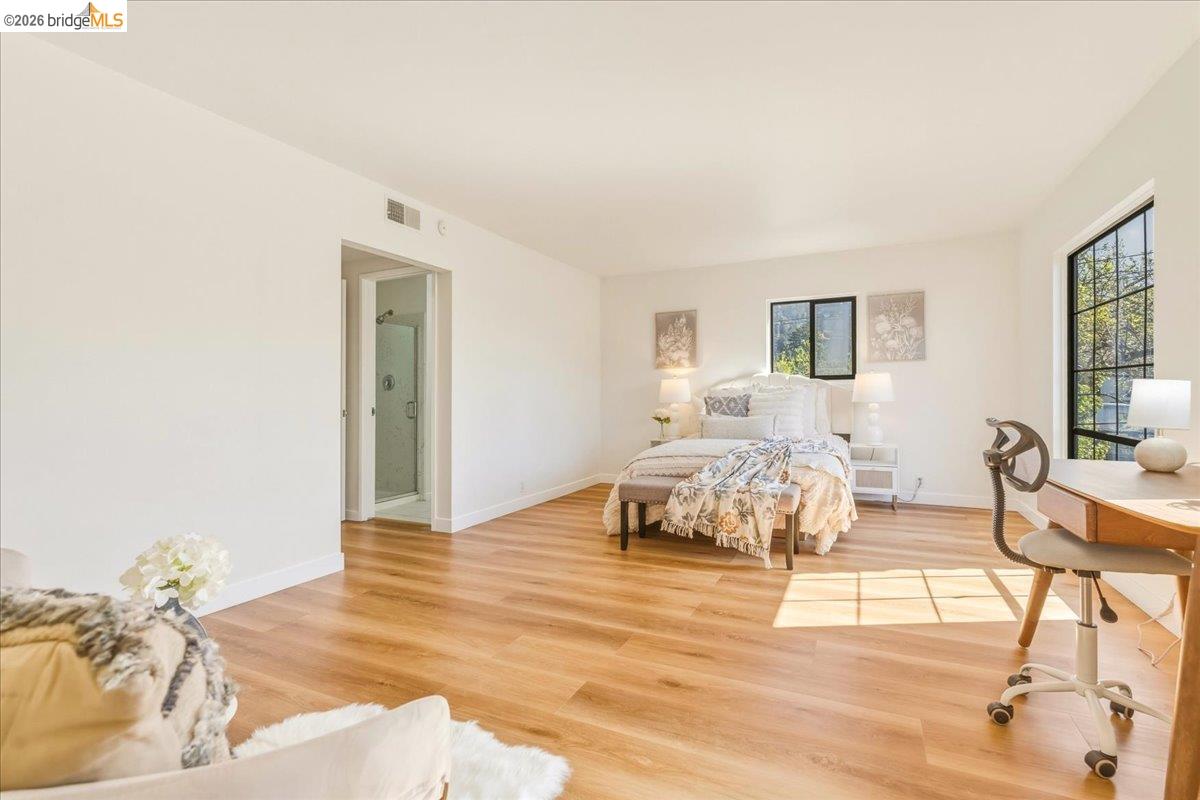 1408 Henry Street Berkeley, CA 94709 - Photo 16 of 28 Bedroom with light wood-style floors and baseboards
