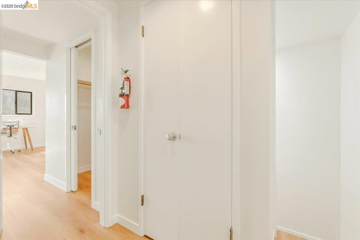 1408 Henry Street Berkeley, CA 94709 - Photo 18 of 28 Corridor with light wood finished floors and baseboards