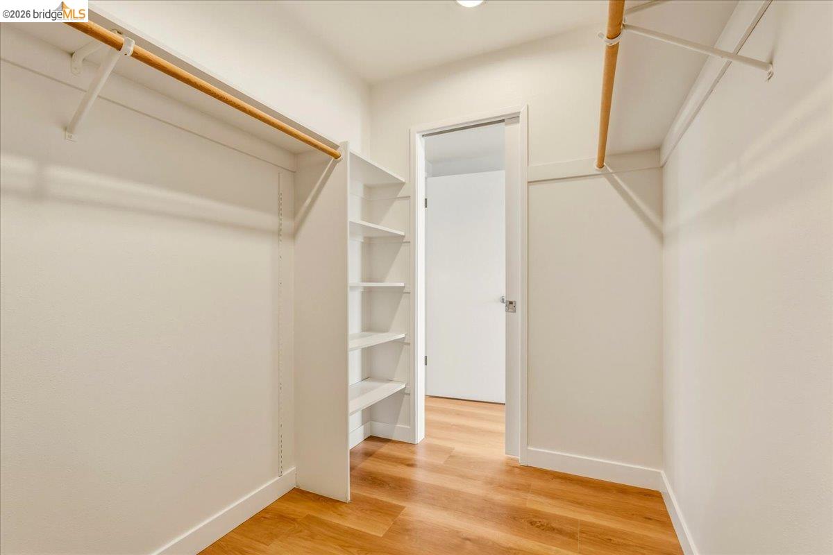 1408 Henry Street Berkeley, CA 94709 - Photo 20 of 28 Walk in closet featuring light wood-style flooring