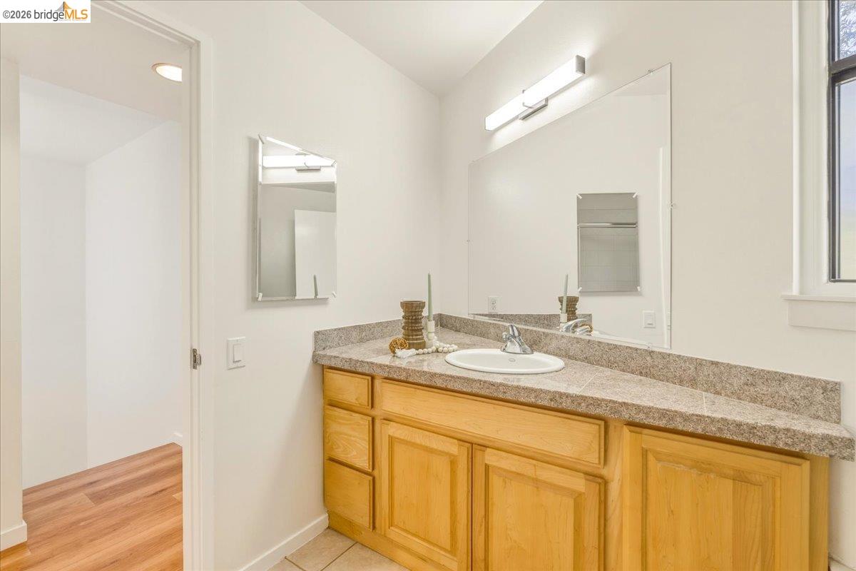 1408 Henry Street Berkeley, CA 94709 - Photo 24 of 28 Bathroom featuring vanity and baseboards