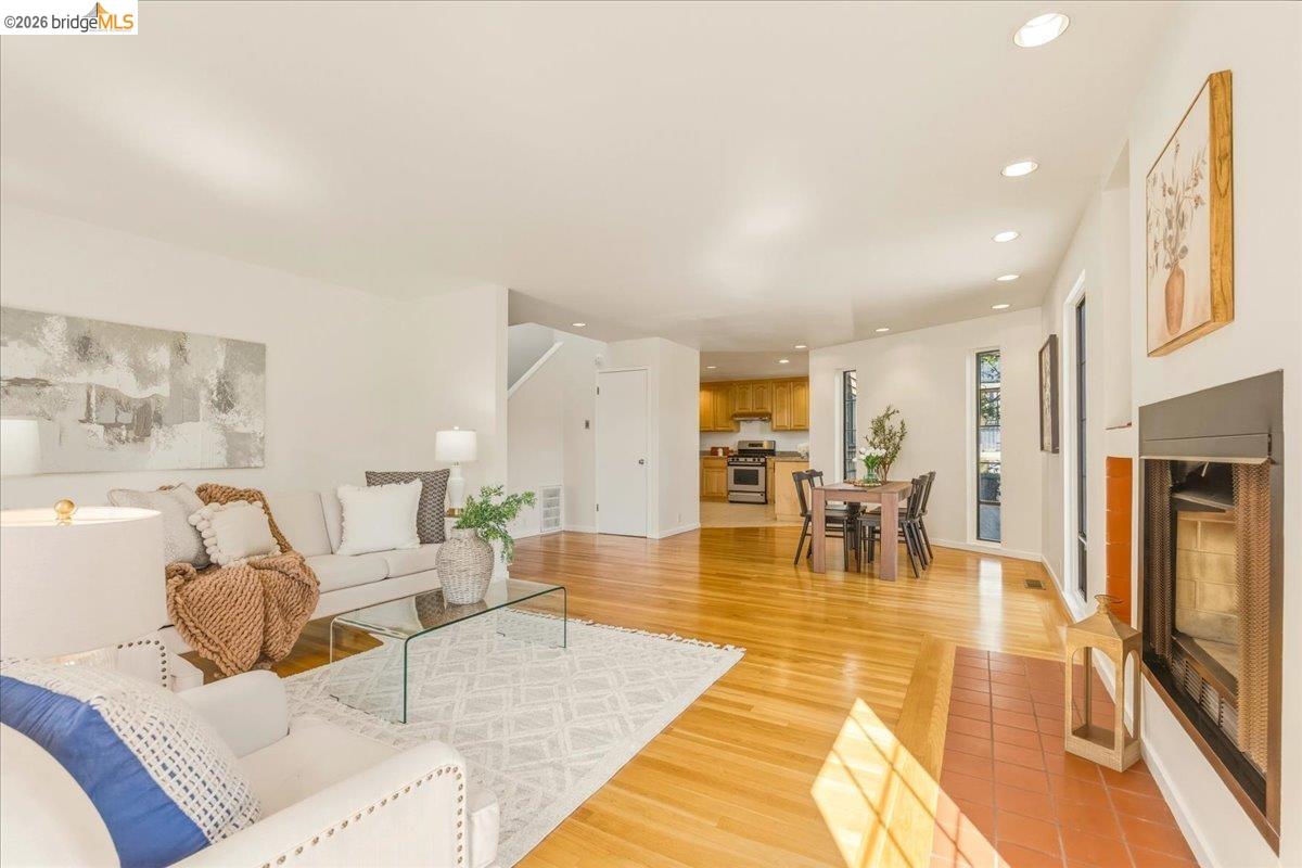 1408 Henry Street Berkeley, CA 94709 - Photo 7 of 28 Living room featuring recessed lighting, a fireplace, and light wood-type flooring