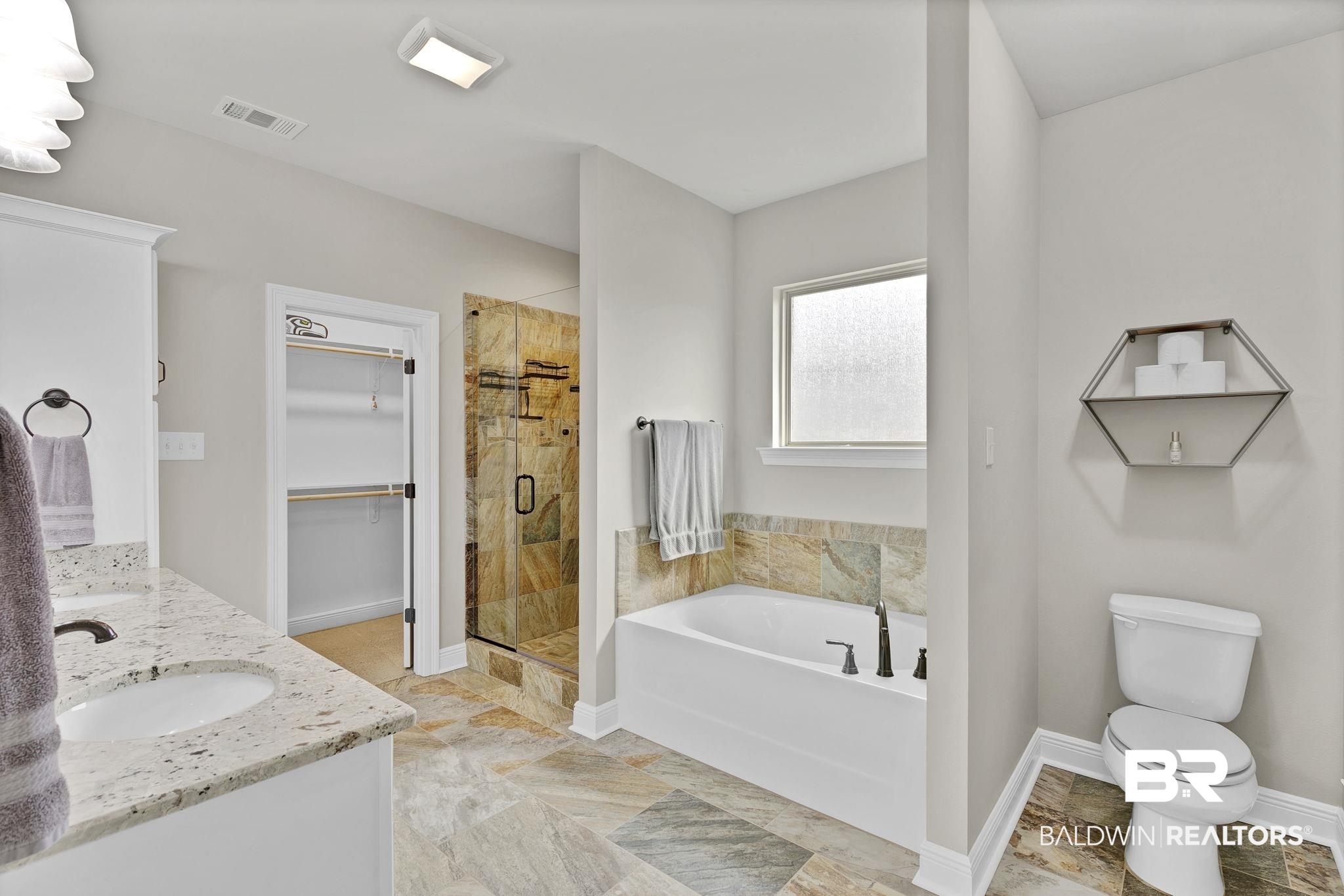 11247 Thistledown Loop Spanish Fort, AL 36527 - Photo 24 of 72 Full bath featuring visible vents, a spacious closet, a sink, a shower stall, and a bath
