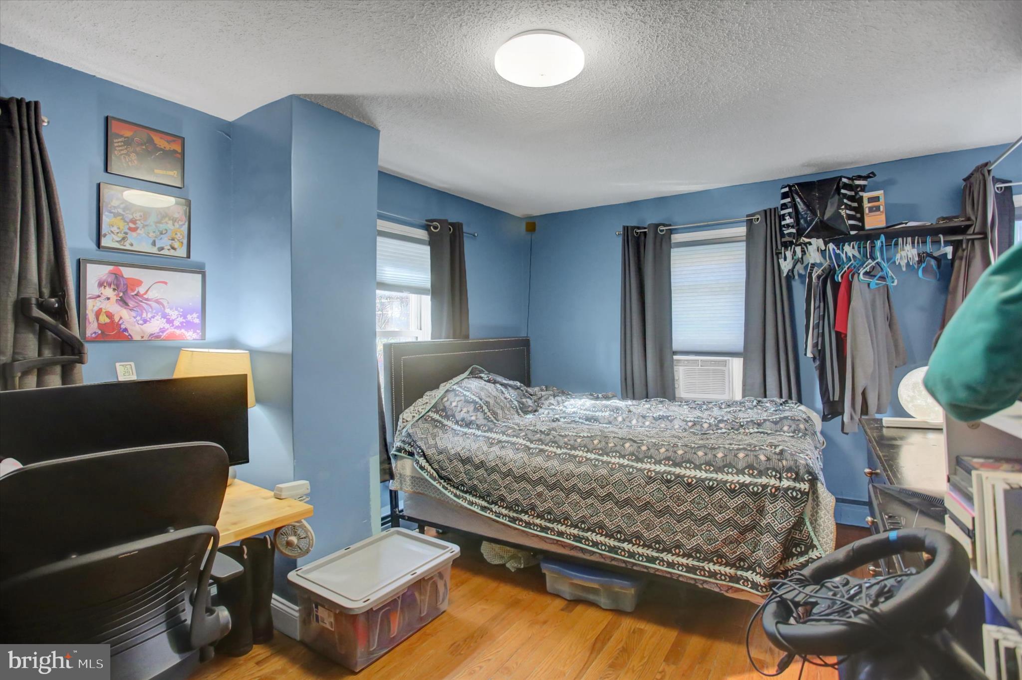 13422 Pennersville Road Waynesboro, PA 17268 - Photo 18 of 31 a bedroom with a bed dresser and a flat screen tv