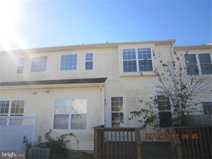 22 Bryce Road Berlin, NJ 08009 - Photo 2 of 17 front view of house with a brick wall
