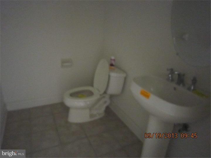 22 Bryce Road Berlin, NJ 08009 - Photo 9 of 17 a white toilet sitting next to a bathroom sink