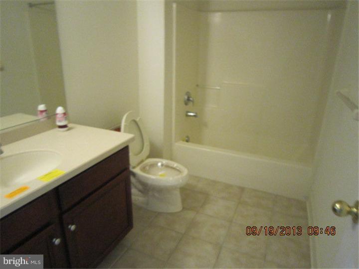 22 Bryce Road Berlin, NJ 08009 - Photo 10 of 17 a bathroom with a sink a toilet and shower