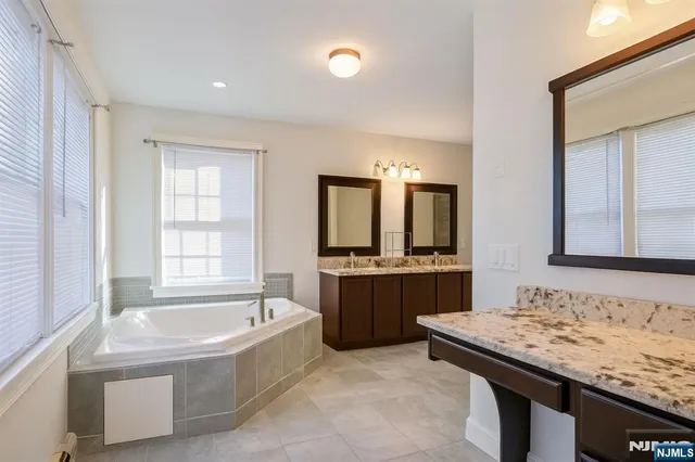 a open kitchen with sink and cabinets