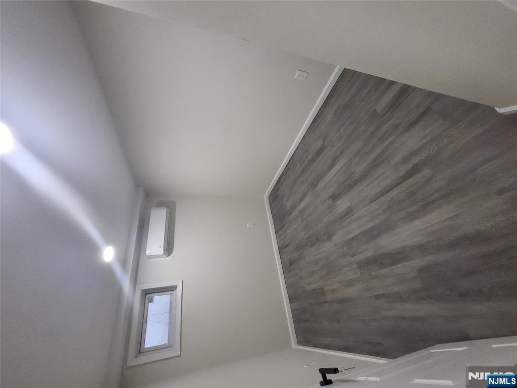 457 Elm Street Stirling, NJ 07980 - Photo 17 of 25 an empty room with wooden floor