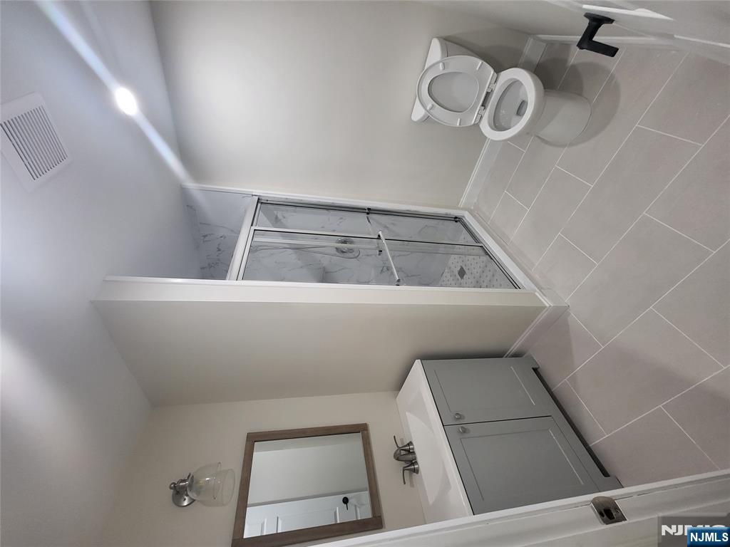 457 Elm Street Stirling, NJ 07980 - Photo 18 of 25 a bathroom with a sink toilet and shower