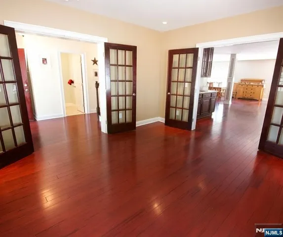 a spacious bathroom with a granite countertop tub sink and mirror