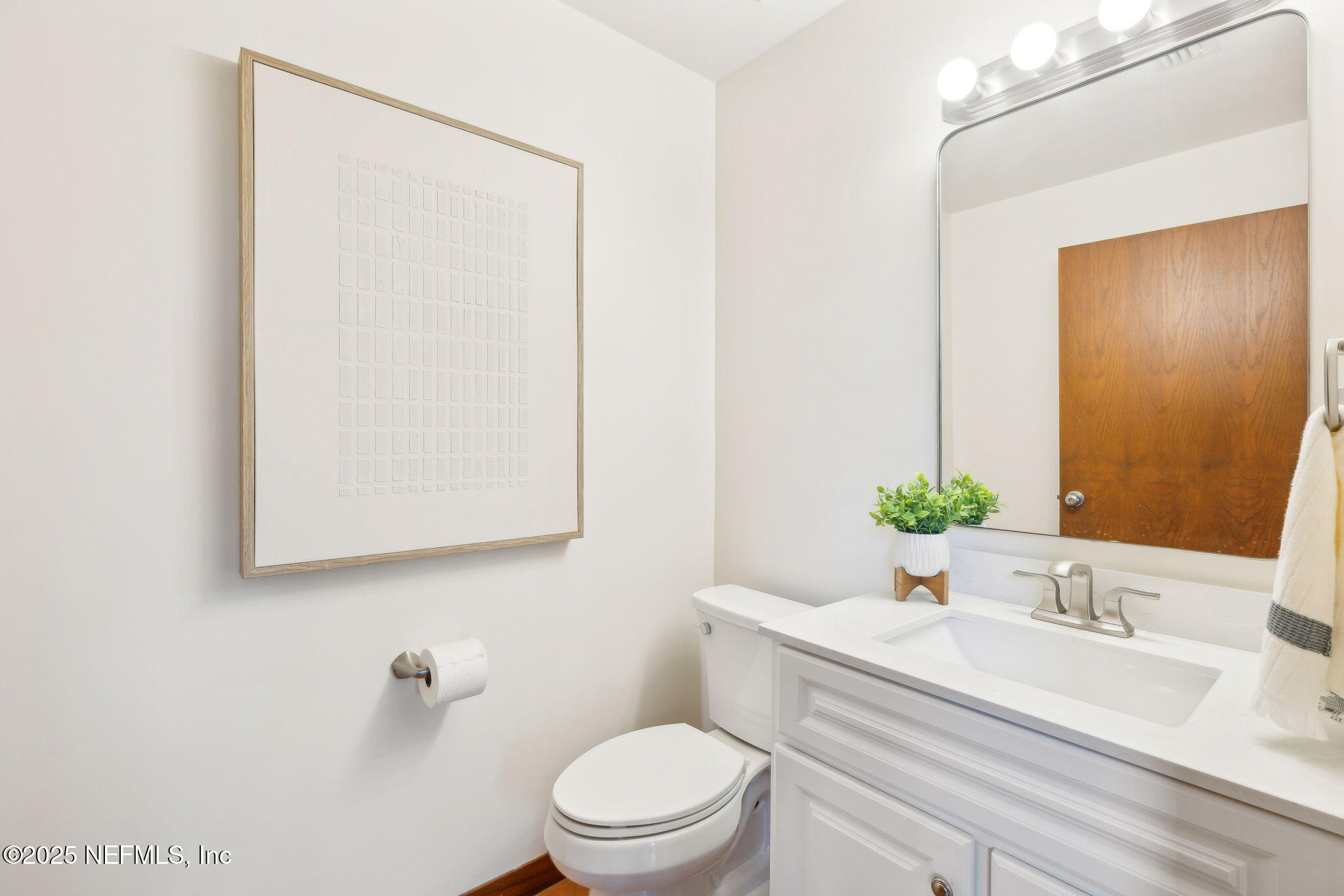 83 Tallwood Road Jacksonville Beach, FL 32250 - Photo 16 of 66 a bathroom with a granite countertop sink mirror vanity and toilet