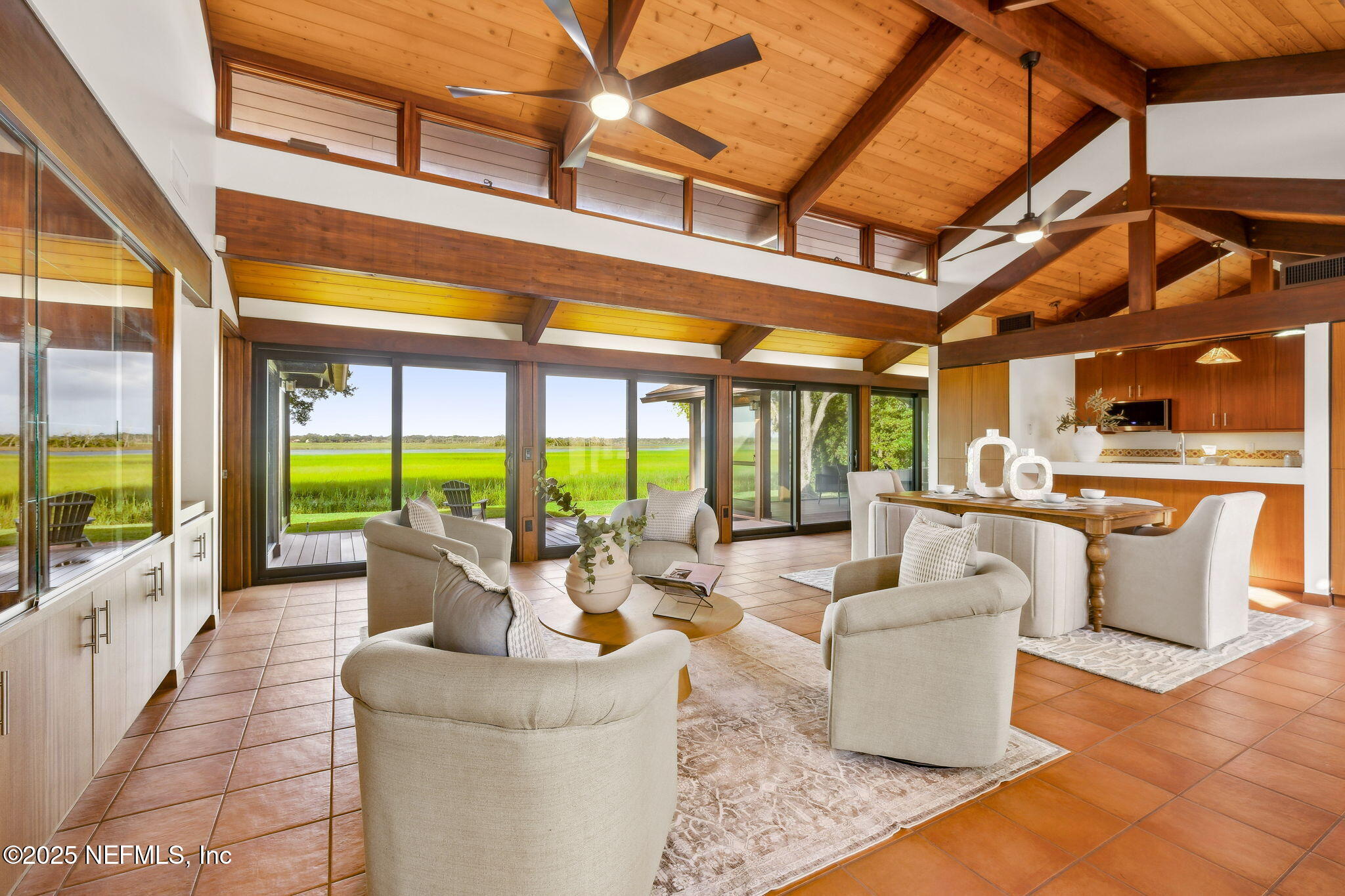 83 Tallwood Road Jacksonville Beach, FL 32250 - Photo 2 of 66 a living room with furniture and a floor to ceiling window