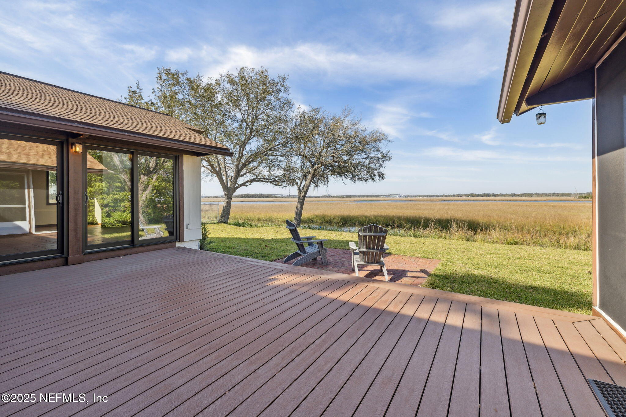 83 Tallwood Road Jacksonville Beach, FL 32250 - Photo 32 of 66 a view of a house with a yard from a terrace