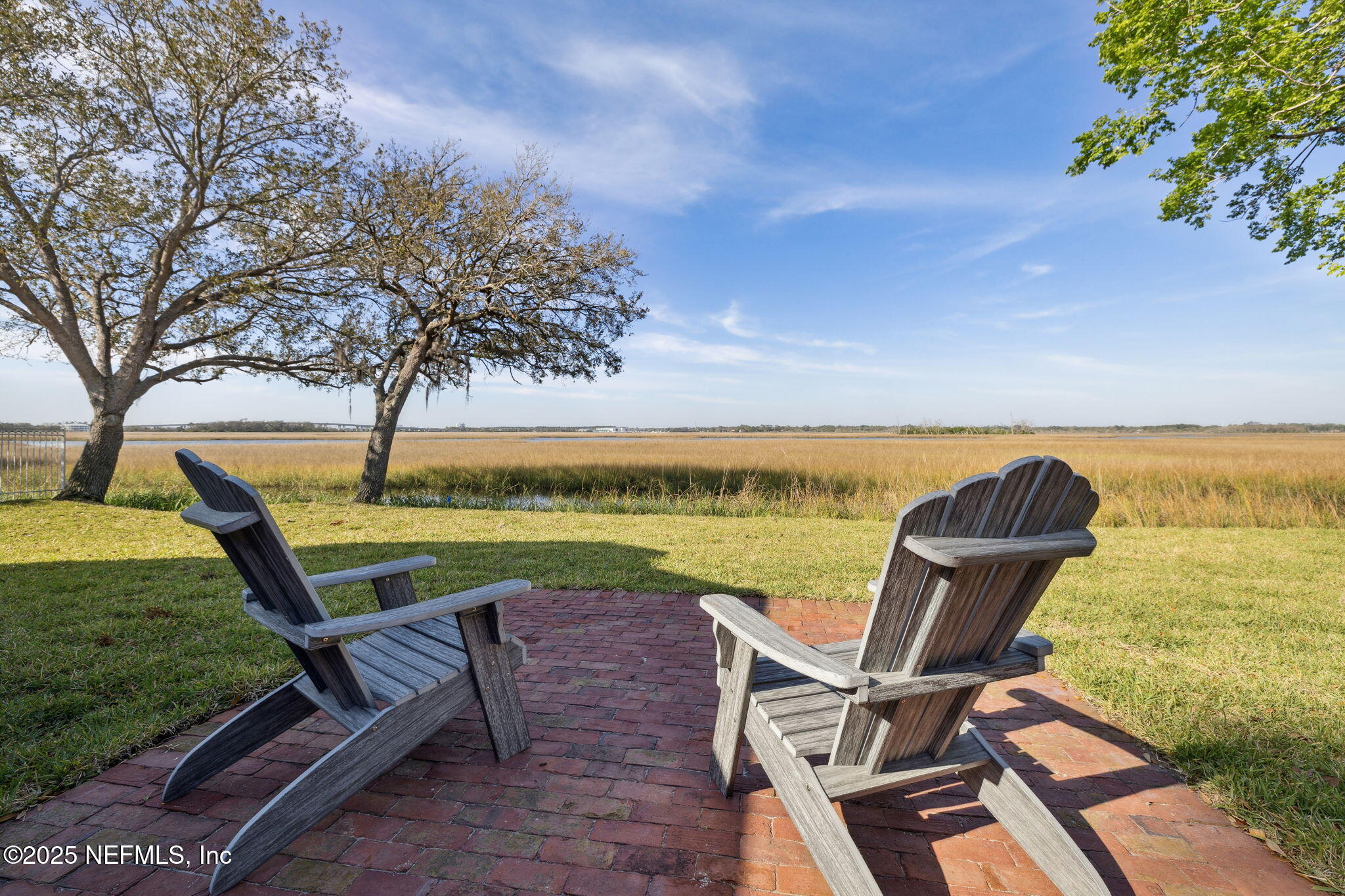 83 Tallwood Road Jacksonville Beach, FL 32250 - Photo 35 of 66 a view of a ocean with a table and chairs