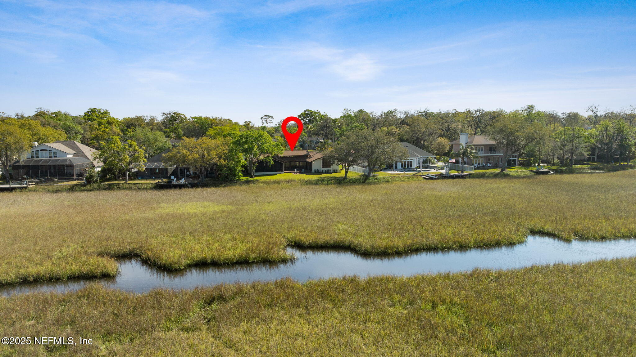 83 Tallwood Road Jacksonville Beach, FL 32250 - Photo 40 of 66 a view of a lake with houses in the back