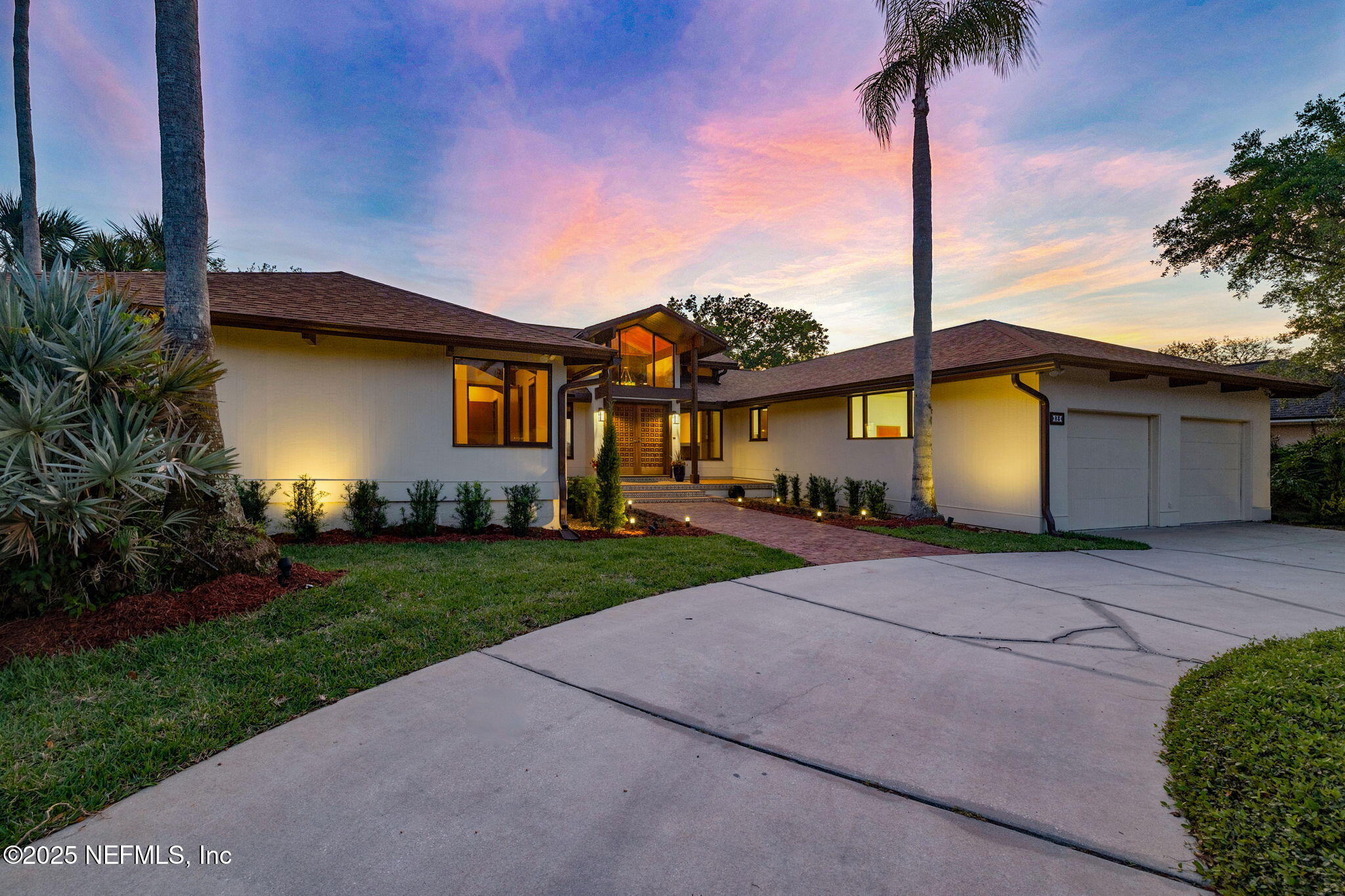 83 Tallwood Road Jacksonville Beach, FL 32250 - Photo 44 of 66 a front view of a house with a garden and yard