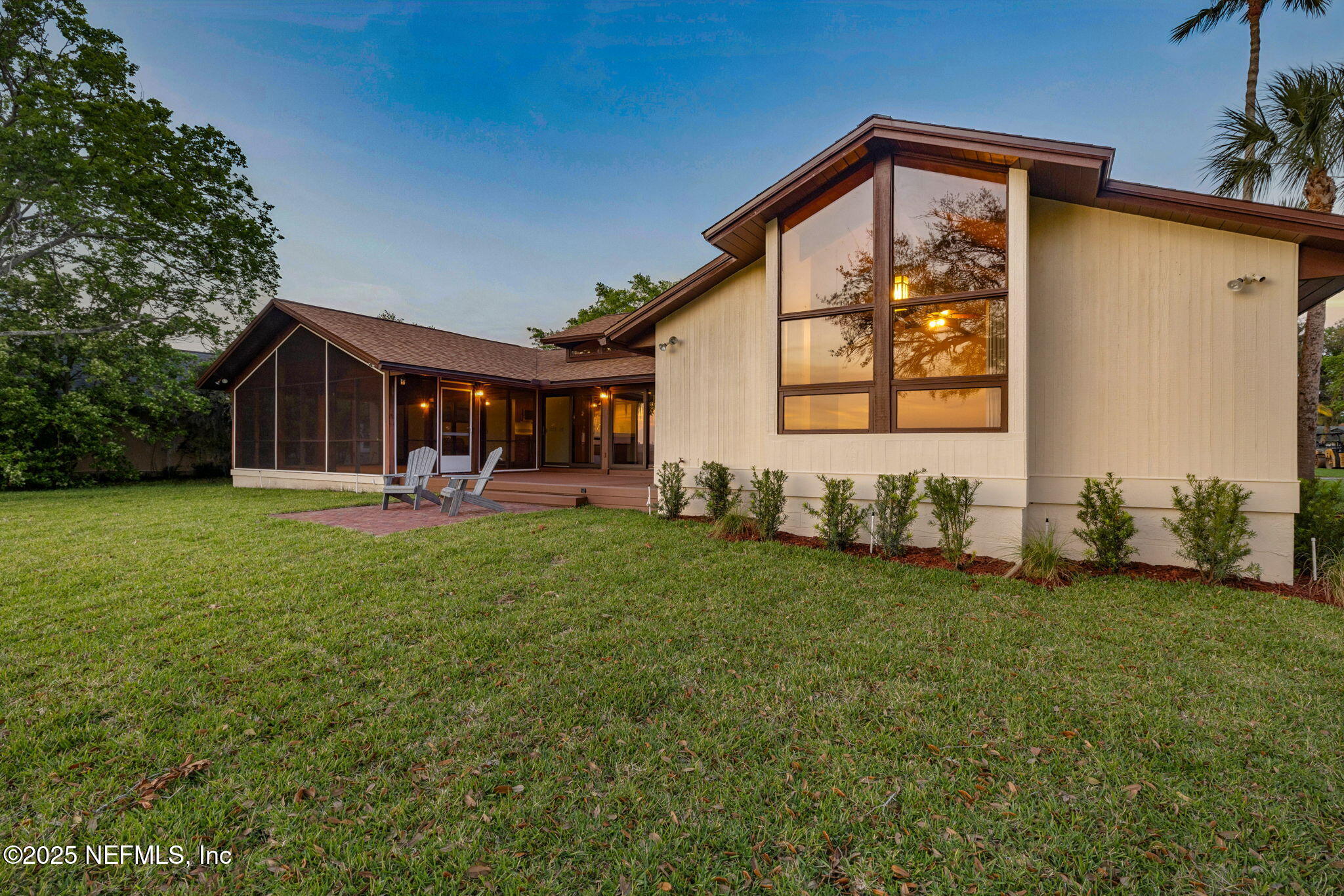 83 Tallwood Road Jacksonville Beach, FL 32250 - Photo 48 of 66 a front view of house with yard and green space