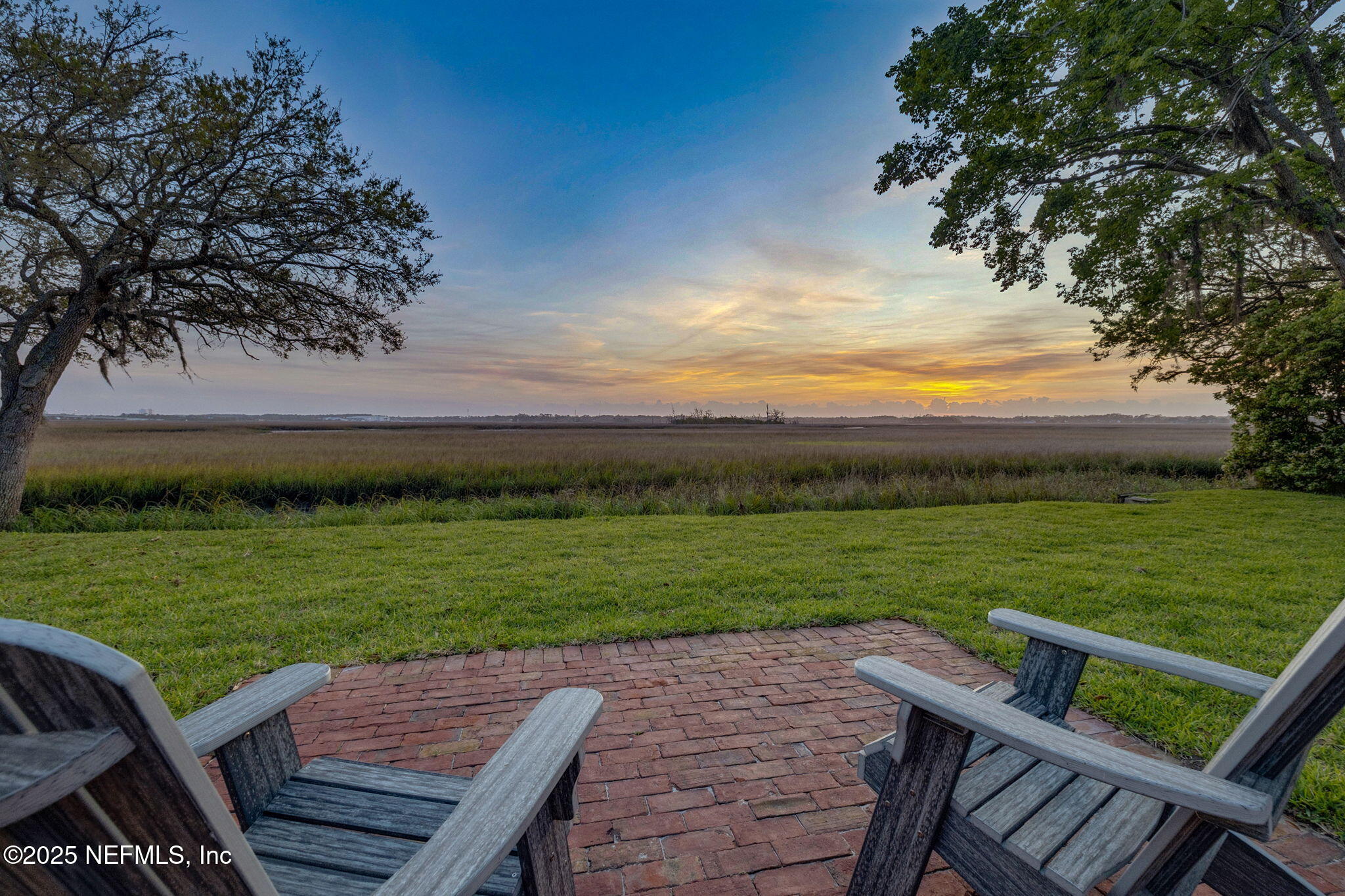 83 Tallwood Road Jacksonville Beach, FL 32250 - Photo 51 of 66 a view of a wooden deck and a yard
