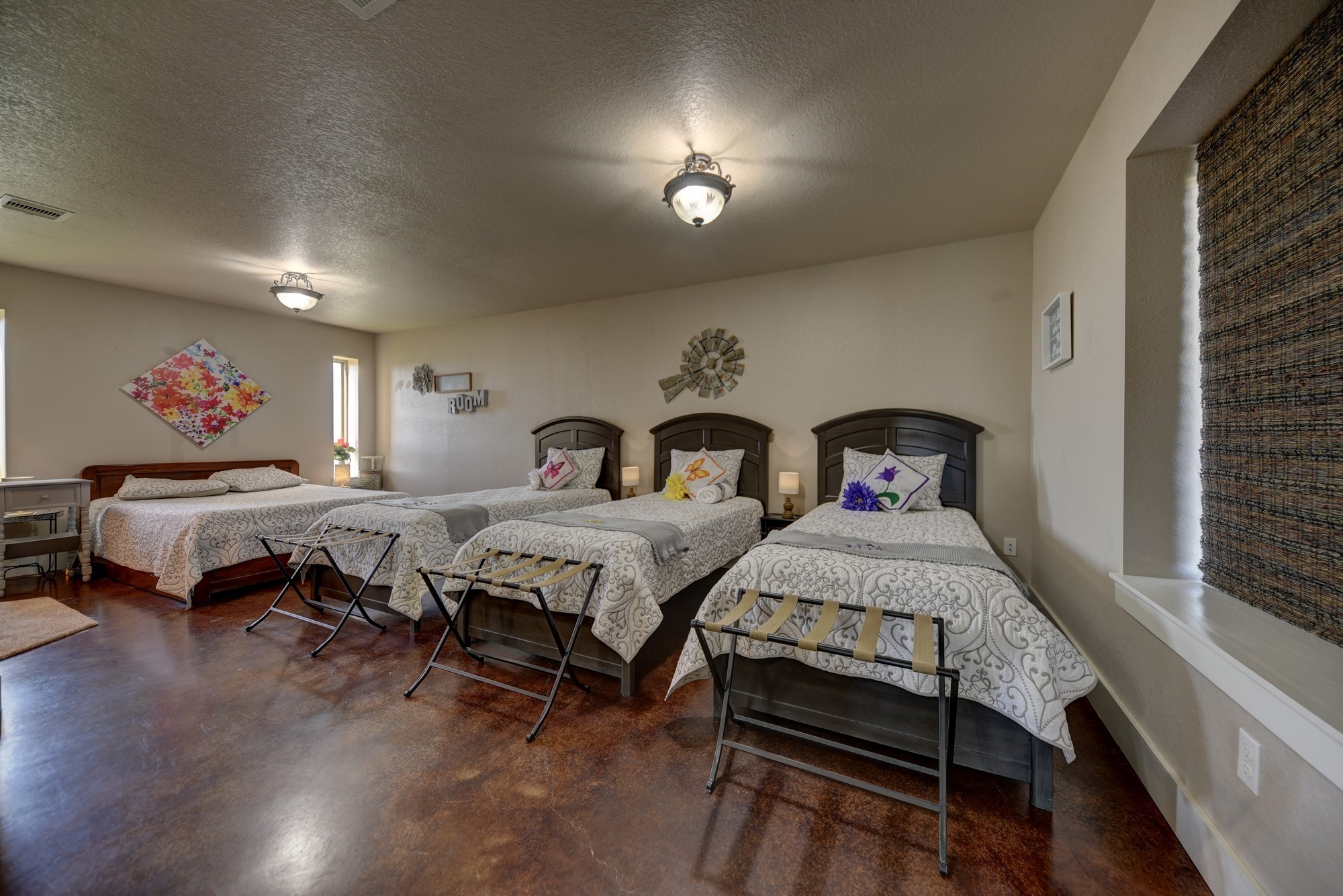 2645 Kallus Road La Grange, TX 78945 - Photo 20 of 25 a spacious bedroom with two beds and a couch