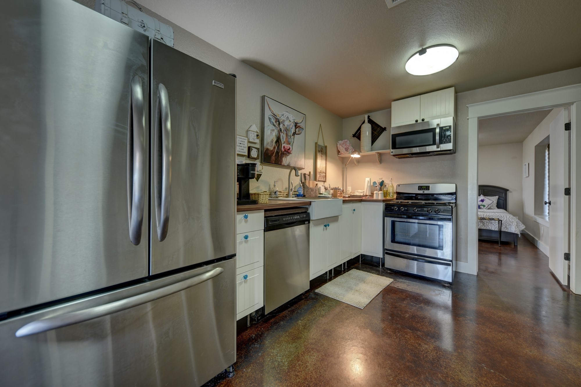 2645 Kallus Road La Grange, TX 78945 - Photo 21 of 25 a kitchen with stainless steel appliances a refrigerator and a stove top oven