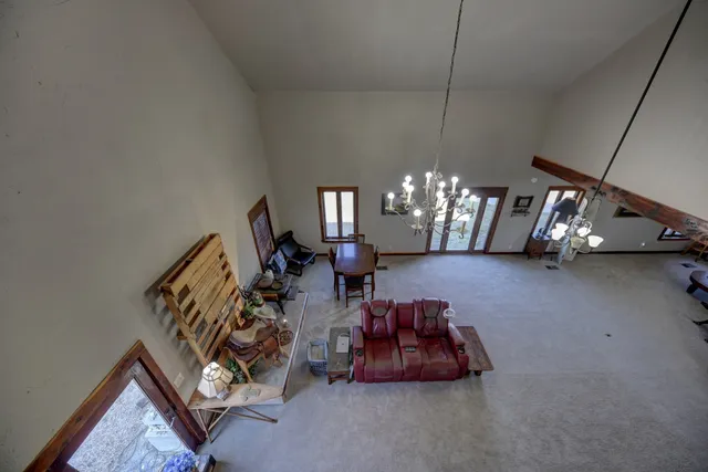 a view of a livingroom with furniture and chandelier