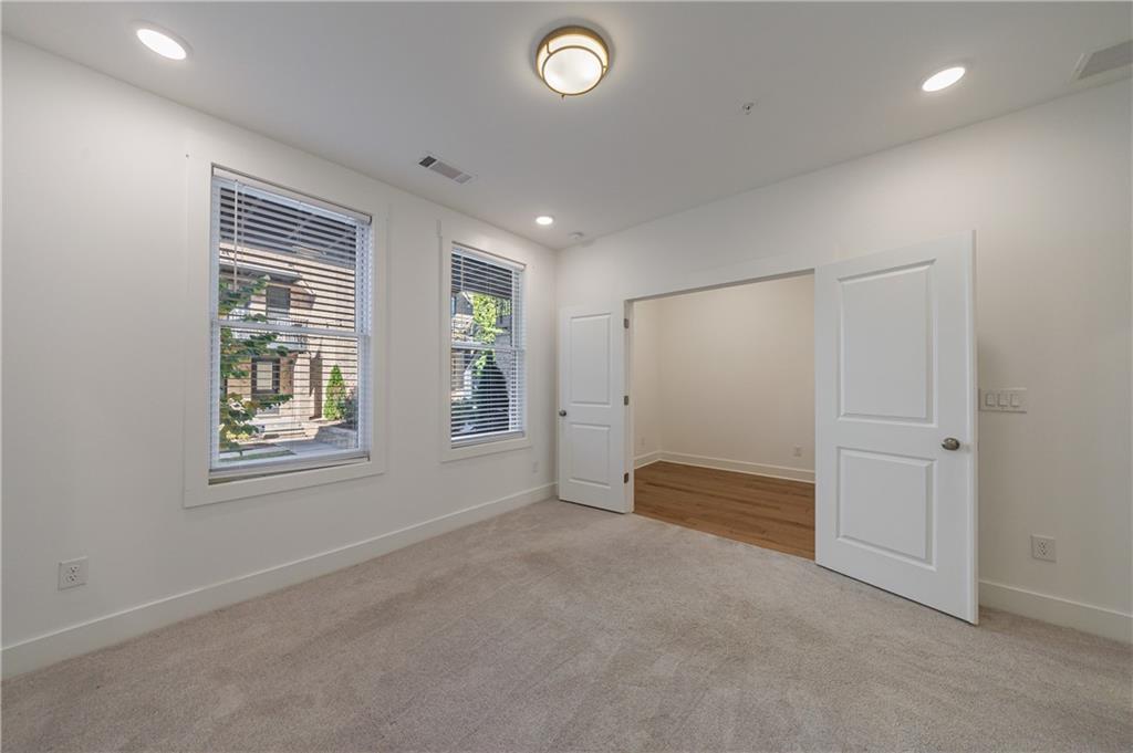 1032 Robert Smalls Way Atlanta, GA 30318 - Photo 20 of 74 an empty room with windows and closet