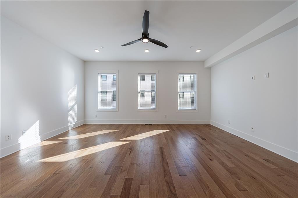 1032 Robert Smalls Way Atlanta, GA 30318 - Photo 33 of 74 a view of an empty room with wooden floor and a window
