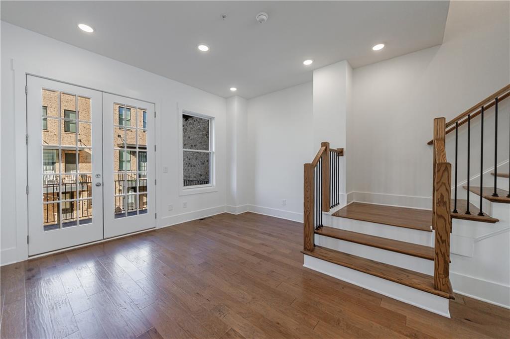 1032 Robert Smalls Way Atlanta, GA 30318 - Photo 37 of 74 a view of front door with wooden floor and stairs