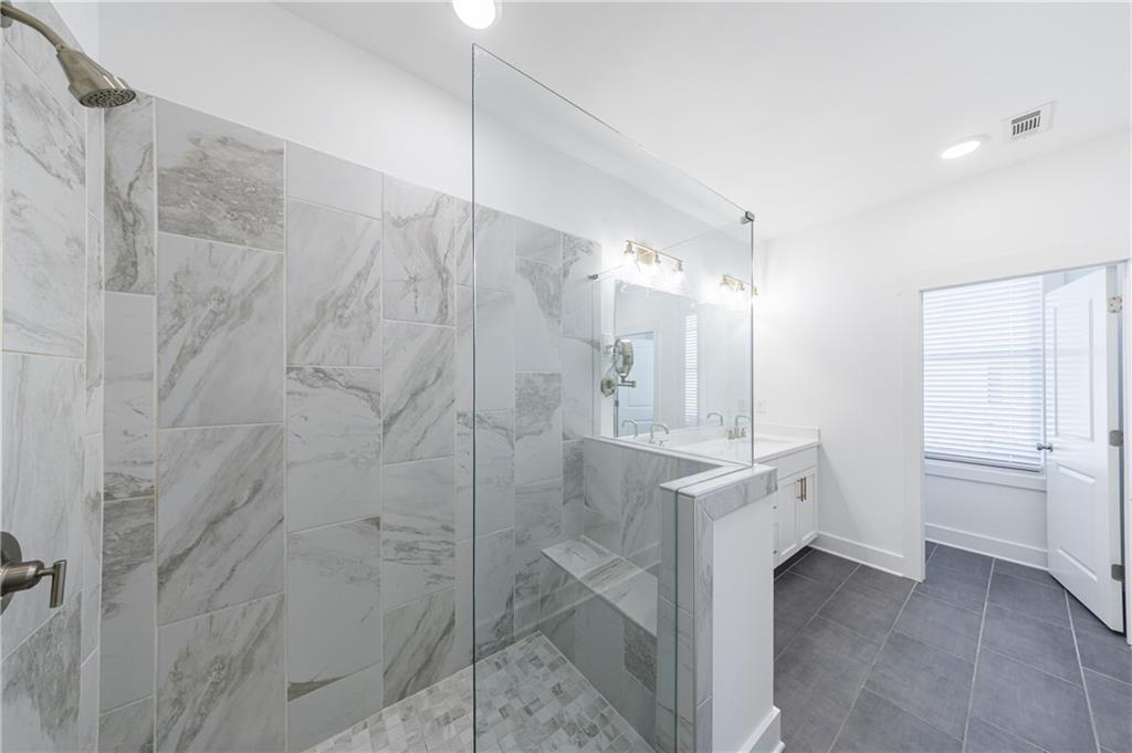 1032 Robert Smalls Way Atlanta, GA 30318 - Photo 43 of 74 a bathroom with a sink a toilet and shower