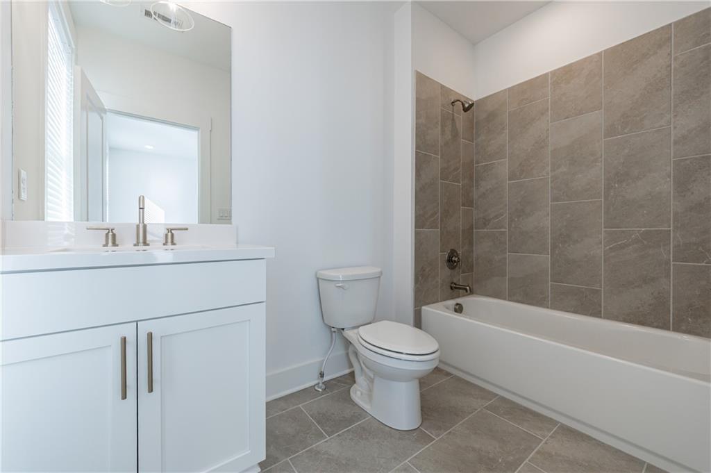 1032 Robert Smalls Way Atlanta, GA 30318 - Photo 50 of 74 a bathroom with a sink toilet and shower