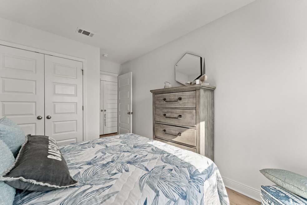 46 Redbird Loop Destin, FL 32541 - Photo 12 of 21 a bedroom with a bed and a dresser
