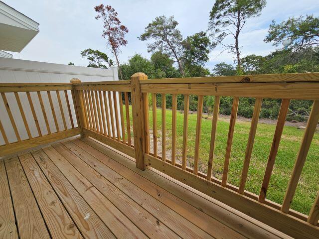 46 Redbird Loop Destin, FL 32541 - Photo 17 of 21 a view of a balcony with wooden floor