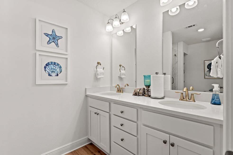46 Redbird Loop Destin, FL 32541 - Photo 9 of 21 a bathroom with a double vanity sink and a mirror
