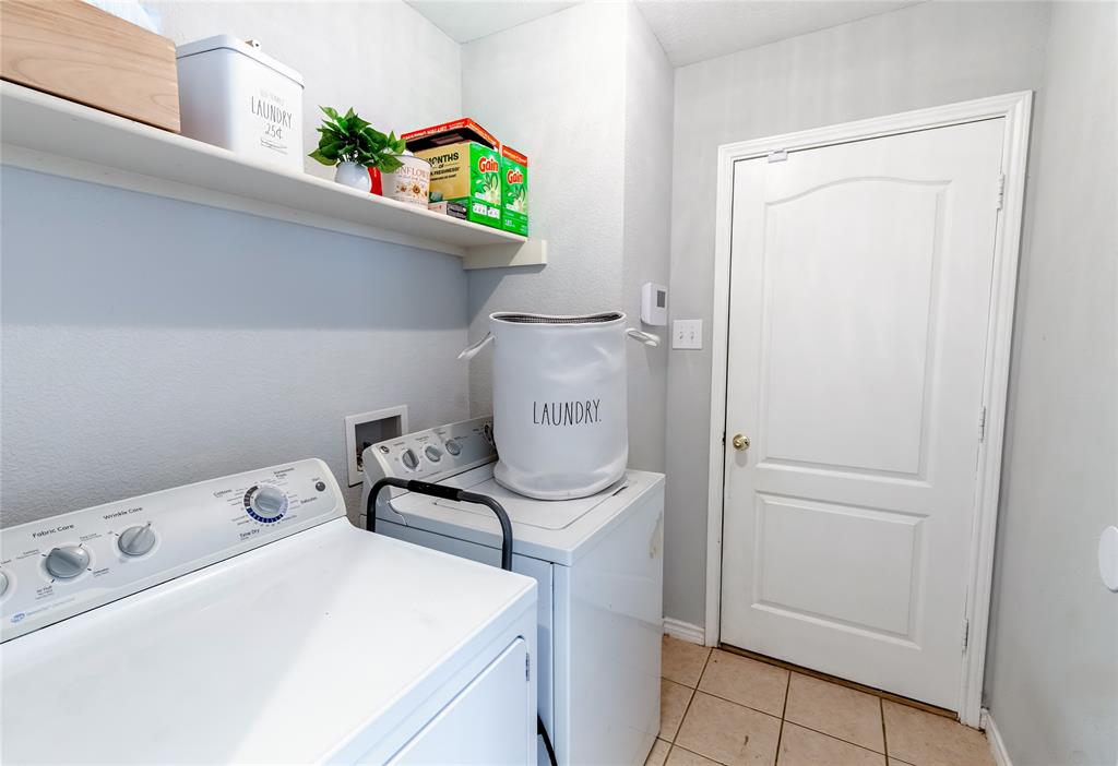 3729 Cook Court Fort Worth, TX 76244 - Photo 12 of 24 a utility room with dryer and washer