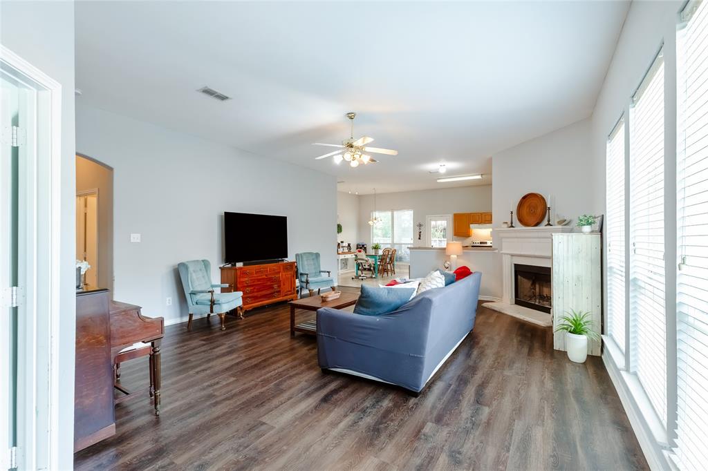 3729 Cook Court Fort Worth, TX 76244 - Photo 17 of 24 a living room with furniture and a fireplace