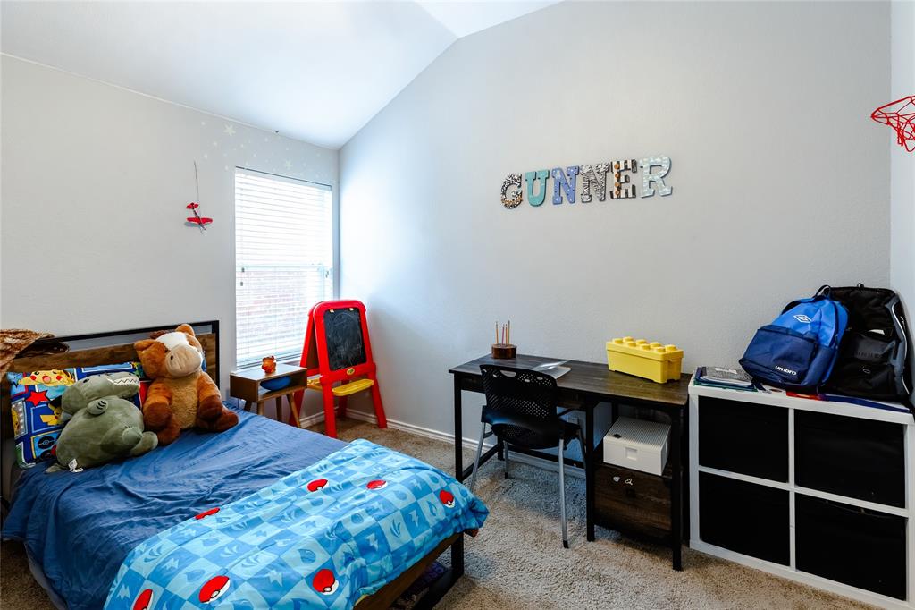 3729 Cook Court Fort Worth, TX 76244 - Photo 19 of 24 a bedroom with a bed and dresser