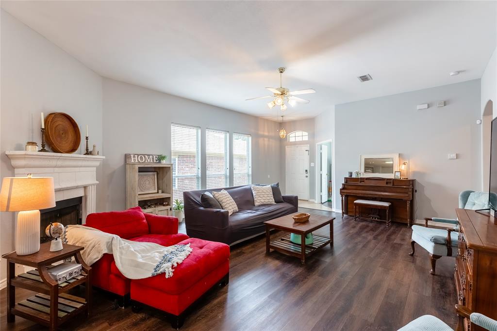 3729 Cook Court Fort Worth, TX 76244 - Photo 4 of 24 a living room with furniture and a fireplace