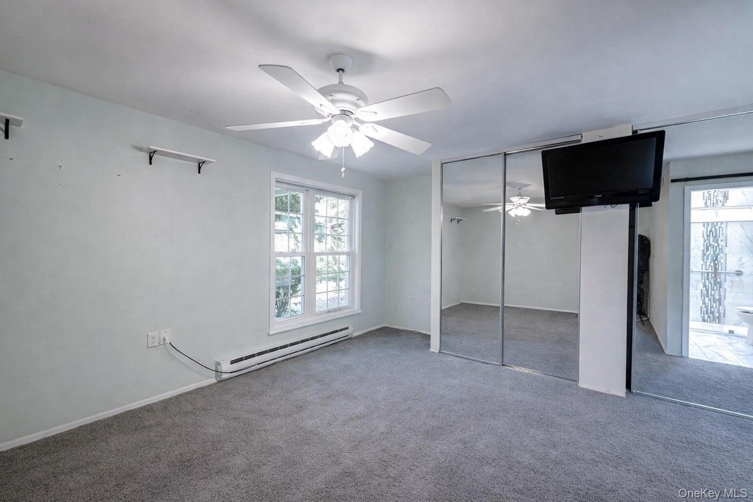 2 Bedford Court Ridge, NY 11961 - Photo 8 of 12 a view of an empty room with a window
