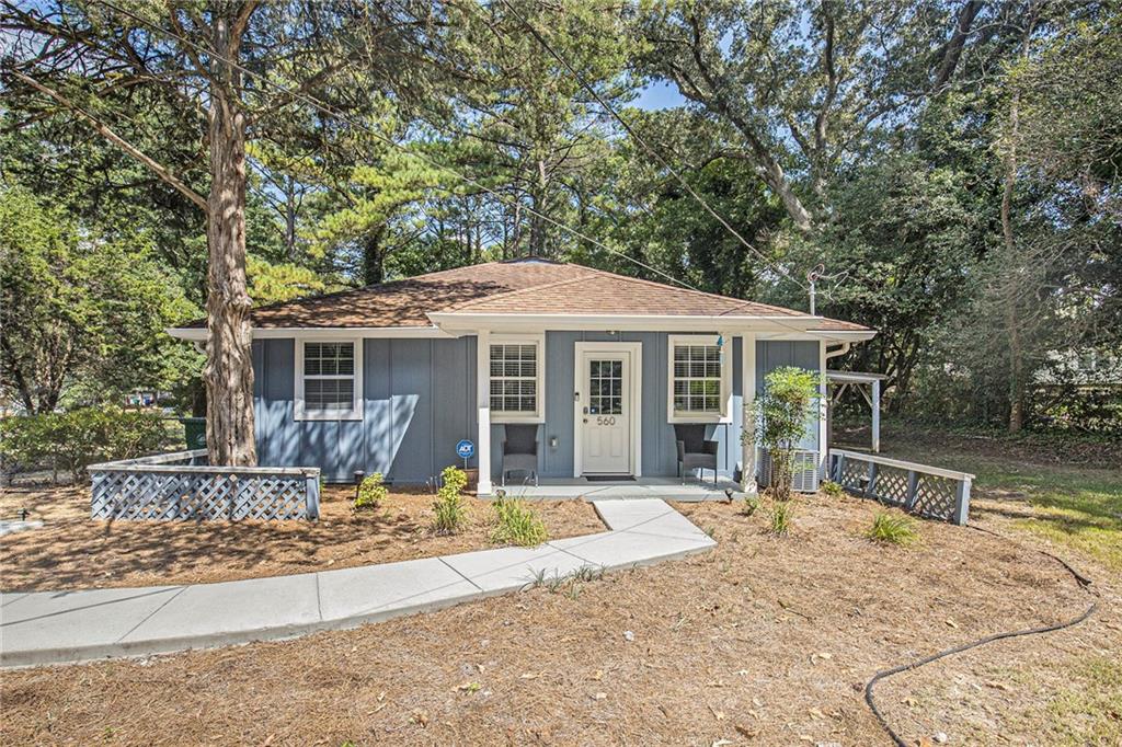 560 Allgood Road Stone Mountain, GA 30083 - Photo 1 of 1 front view of a house with a yard