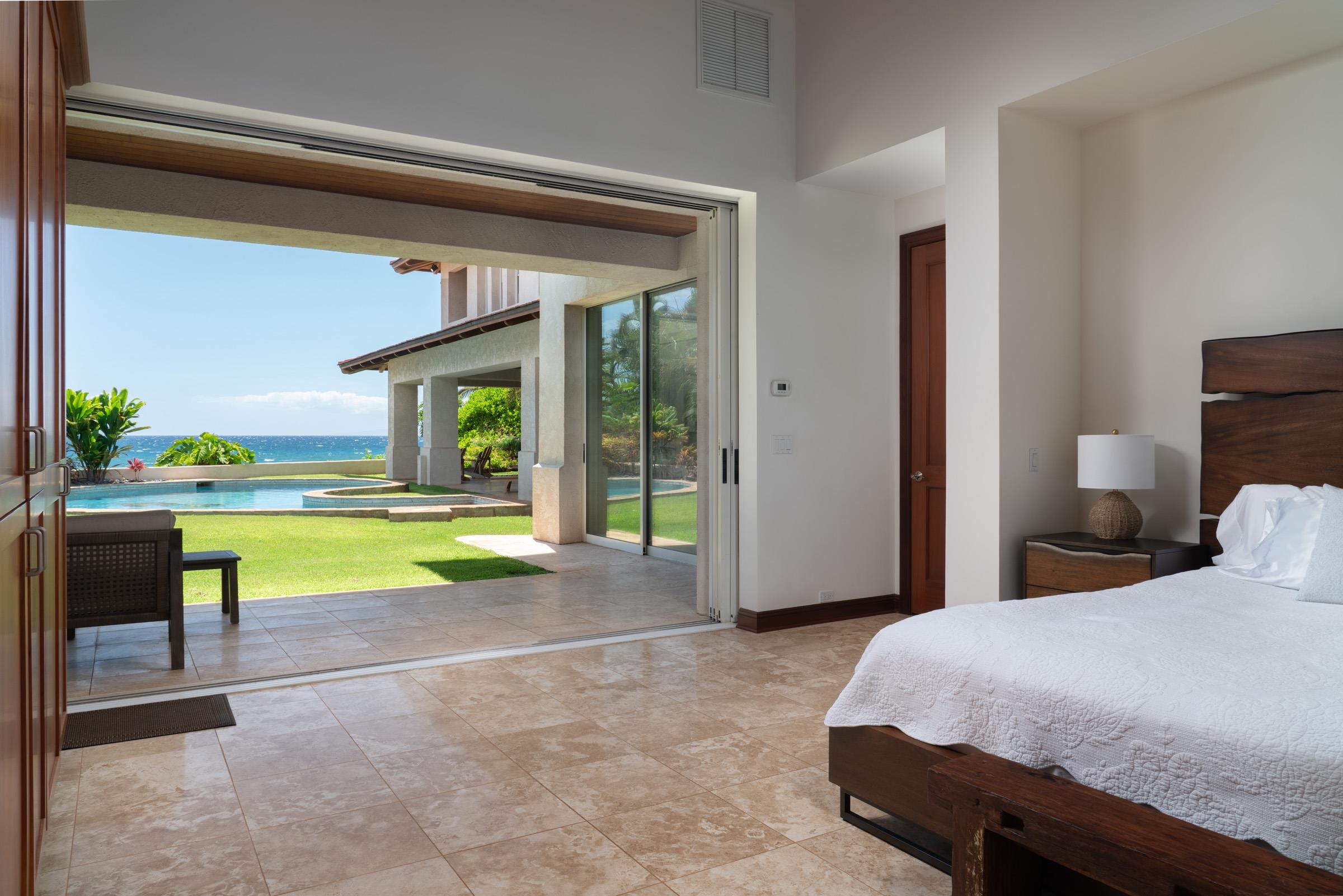 3002 South Kihei Road Kihei, HI 96753 - Photo 16 of 31 a bedroom with a bed and a view of living room