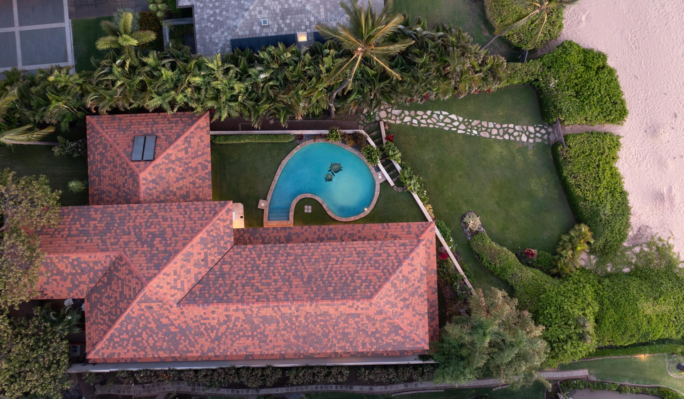 3002 South Kihei Road Kihei, HI 96753 - Photo 4 of 31 an aerial view of a house with a garden