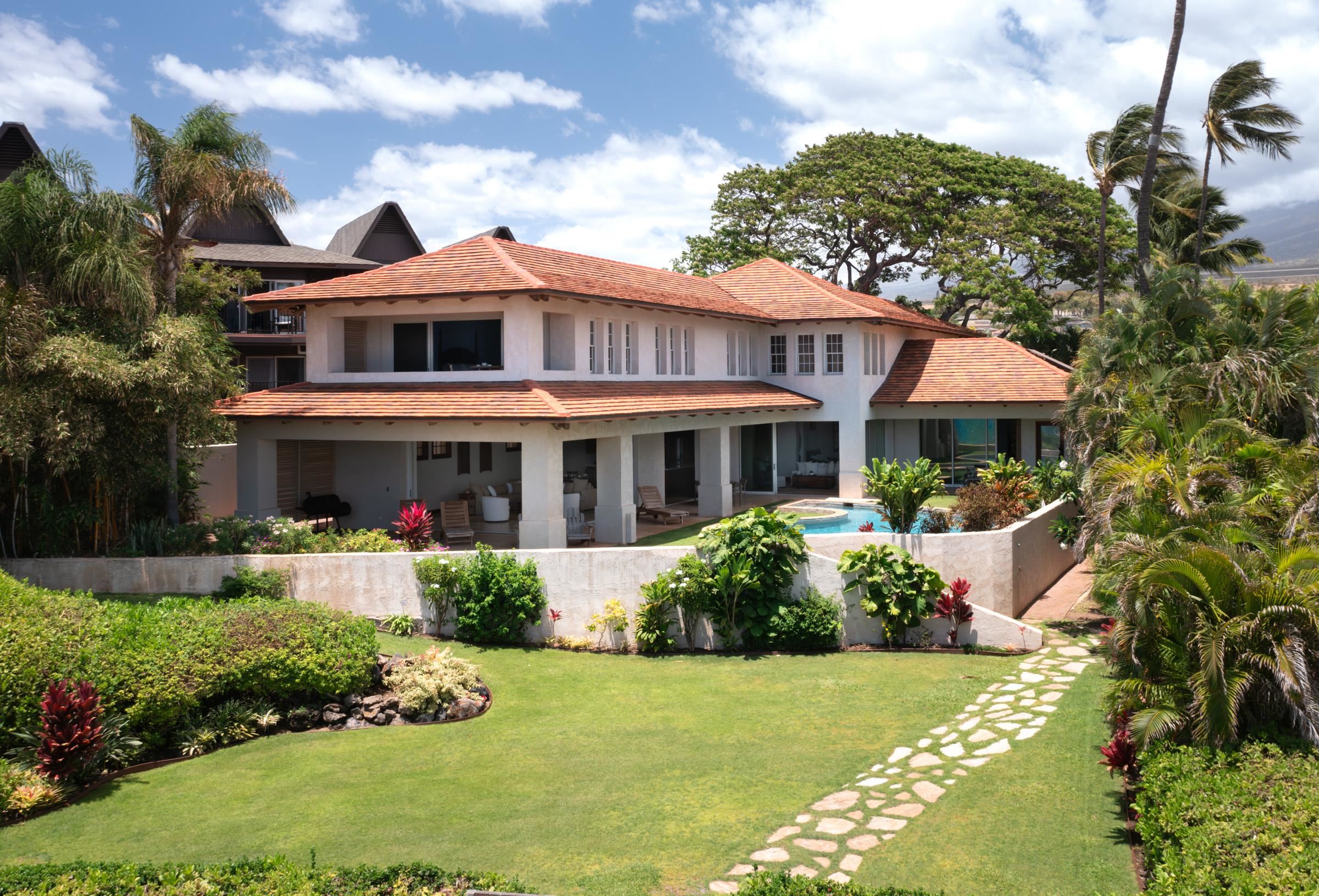 3002 South Kihei Road Kihei, HI 96753 - Photo 6 of 31 a front view of a house with a yard and potted plants