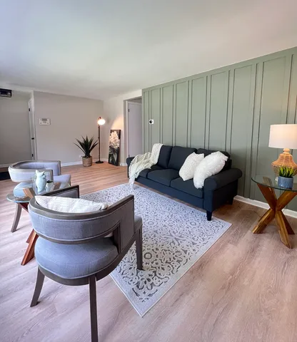 a living room with furniture and a table